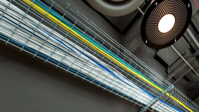Overhead basket cable tray carrying bundled low voltage cable